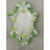 Impressive wall mirror with Murano glass style with transparent elements full of gold leaf and green flowers. Oval mirror...
