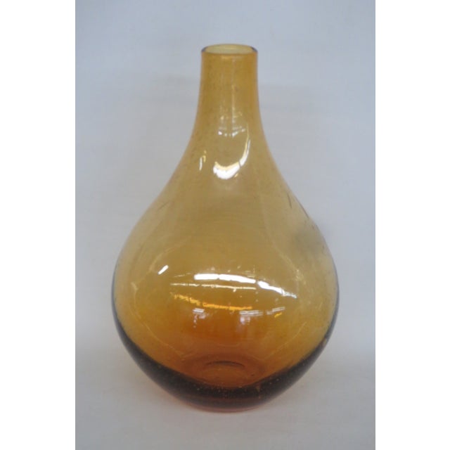 This gorgeous Large Vase is made of hand blown art glass. This beautiful vase presents a pear-shaped silhouette with a...