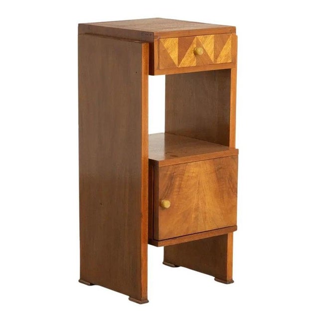 A stylish British Art Deco side cabinet in richly figured walnut, dating from circa 1930. Compact and beautifully...