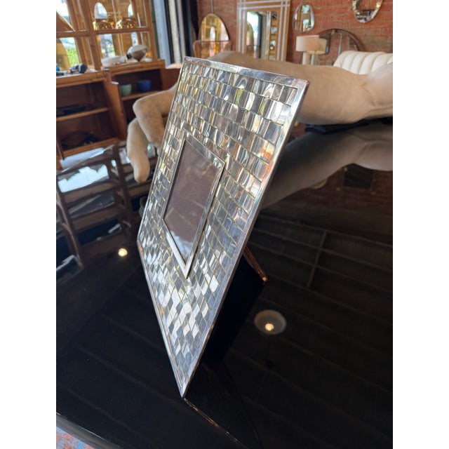 A striking vintage Italian picture frame featuring a meticulously hand-woven silver-plated metal surface in an intricate...