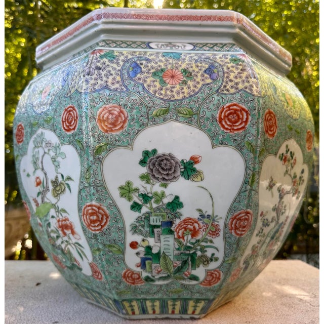 A beautiful antique large 18th century Qing Dynasty Verte Famille Jardiniere. Octagon shaped pot measuring 16” x 16”, with...