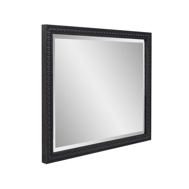 The Beaded Mirror features a timeless design with a delicate beaded border. Its neutral finish and sophisticated detailing...
