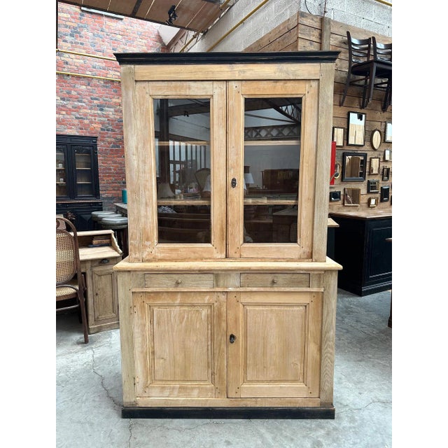 This old poplar and oak china cabinet has been fully restored. It comprises an upper section with 2 glass doors opening...