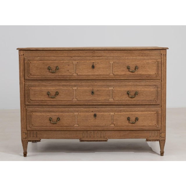 Crafted in France during the early nineteenth century, this chest of drawers embodies the enduring elegance of the Louis...