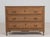 Crafted in France during the early nineteenth century, this chest of drawers embodies the enduring elegance of the Louis...