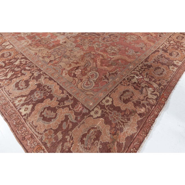 This exceptional antique Turkish Hereke rug, woven circa 1900, is a testament to the regal craftsmanship and artistic...