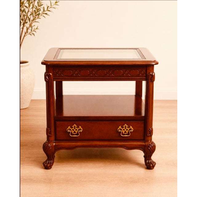 Bring timeless American craftsmanship into your home with this handsome matched pair of vintage Bassett end tables,...