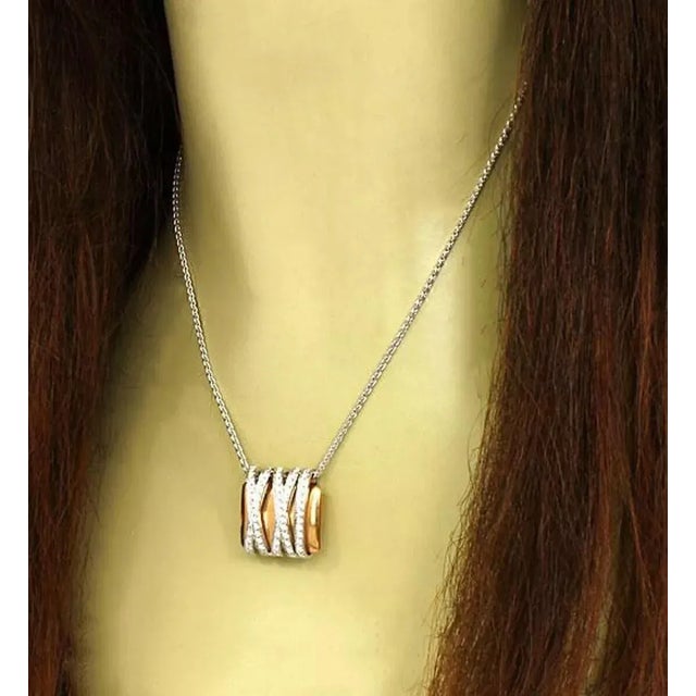 Koesis 18k gold and diamonds trendy pendant with chain. The piece is beautifully crafted in solid 18k white and yellow...