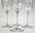 This incredibly dainty and delicate set of champagne flutes is sheer perfection. The wavy crystal bowls create an effect...