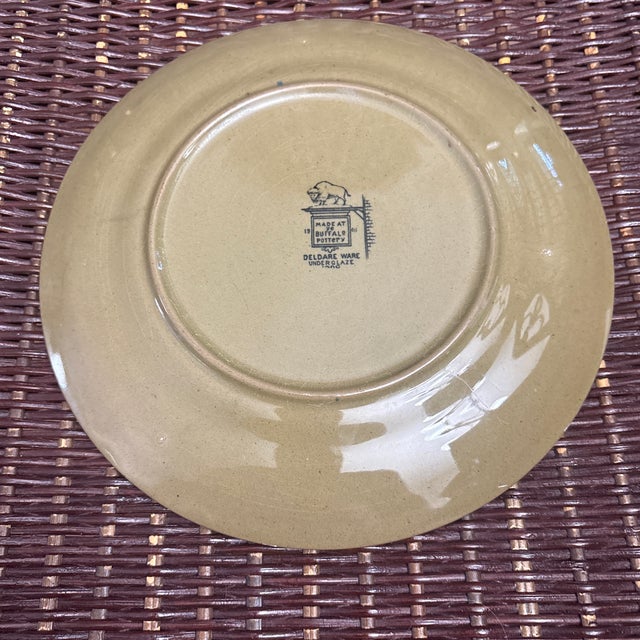 Buffalo Pottery " the Town Crier" 8 1/4" plate circa 1908. Very nice and collectible.