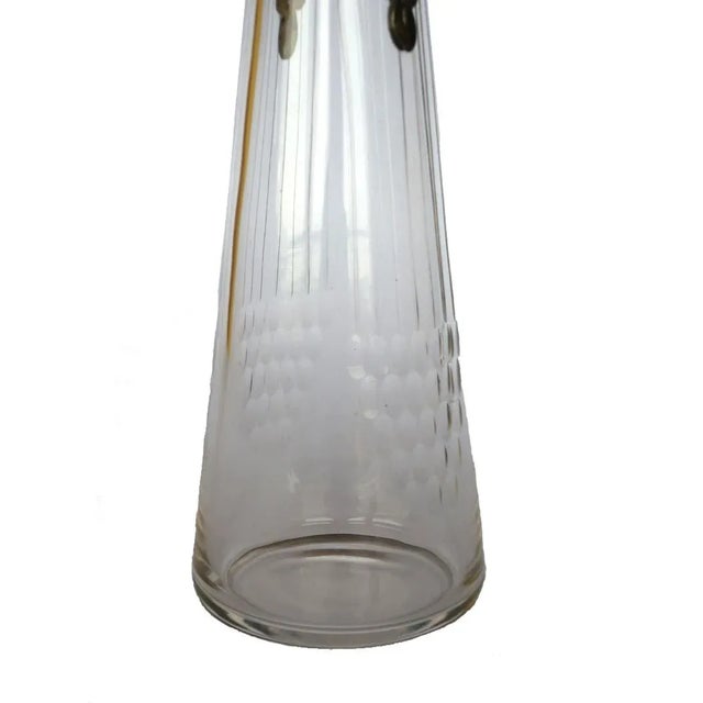 WMF is engraved in the metal of this pewter and crystal jug. Imprinted by Maker