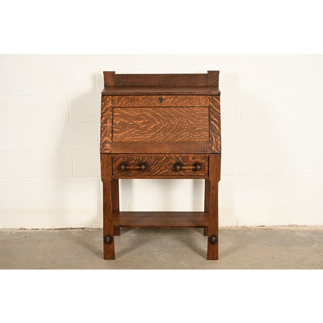 A rare and exceptional antique Mission or Arts & Crafts period quarter sawn oak drop front secretary desk In the manner of...
