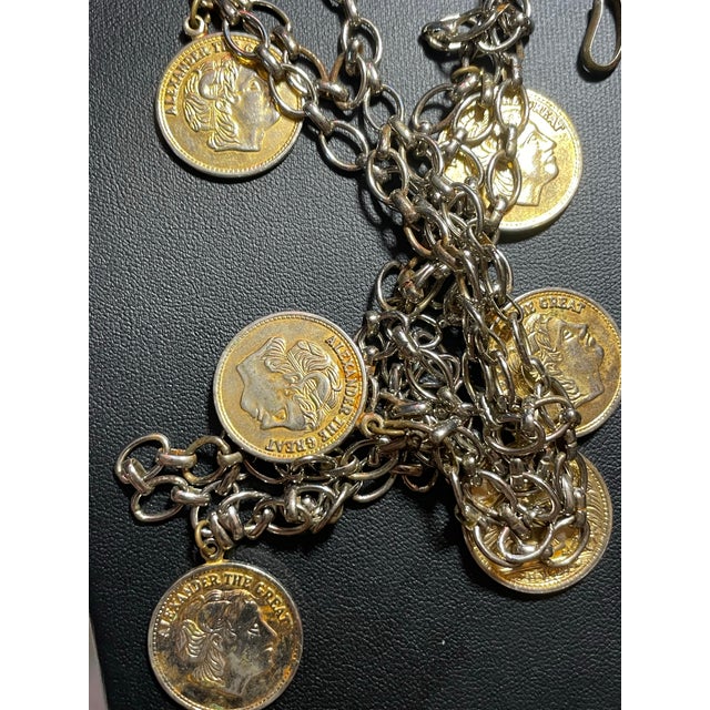 Crafted during the mid-century Greco-Roman Revival era this statement necklace features an open-weave jump ring...