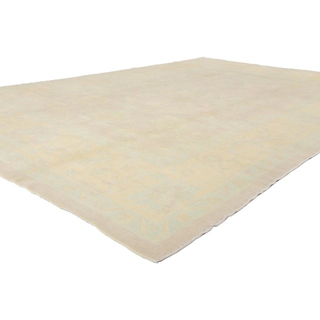 53161 Modern Vintage Muted Turkish Oushak Rug, 09'03 x 13'07. Like morning light brushing softly across ancient Anatolian...