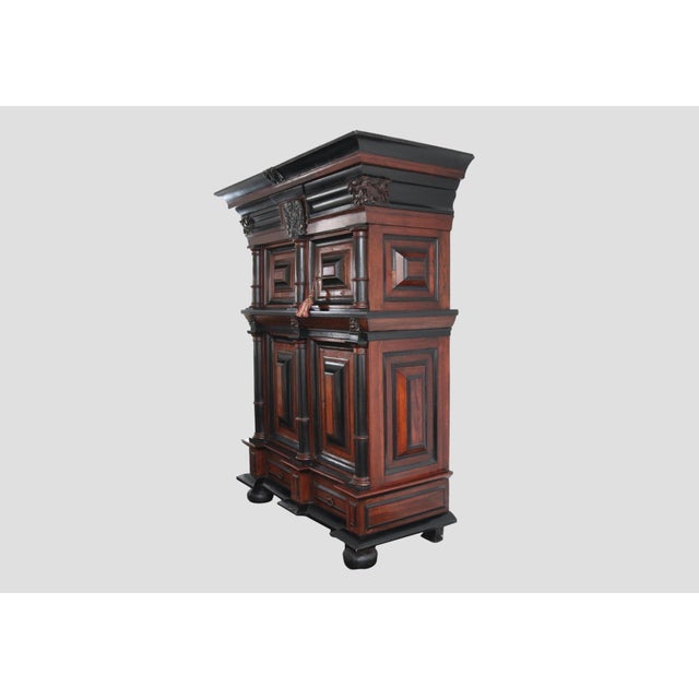A monumental circa 1640 Dutch armoire cabinet known as a Kussenkast (or cushion cabinet) for its bold, deeply recessed...