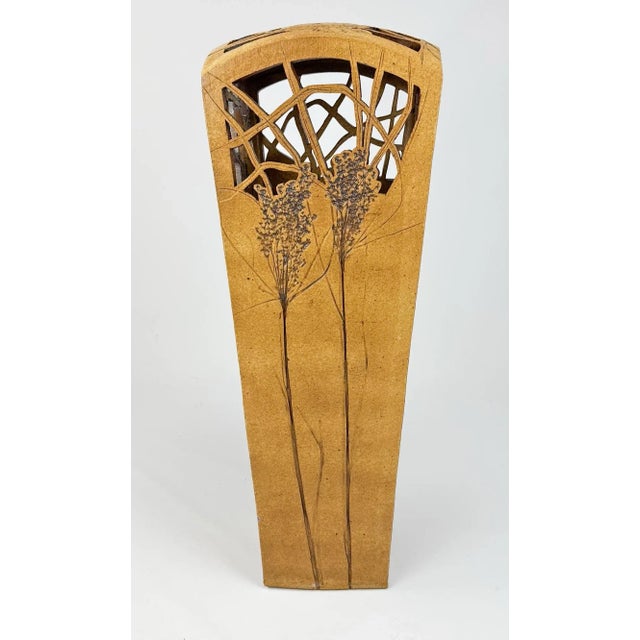 Handmade ceramic sculpture by American artist Dennis Kirchmann (1939-2017). The top is reticulated and the sides are...