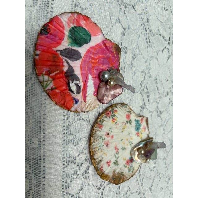 Handcrafted floral seashell trinket tray with assorted seashells, sea glass, opalescent crystals and pearl accents. For...