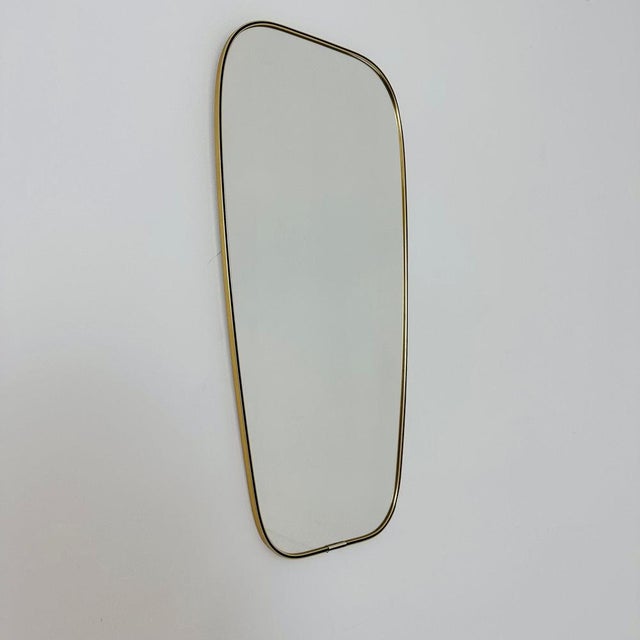 Mid Century asymmetric German brass Original kidney wall mirror from the 60s model number 986 the mirror is MADE in...