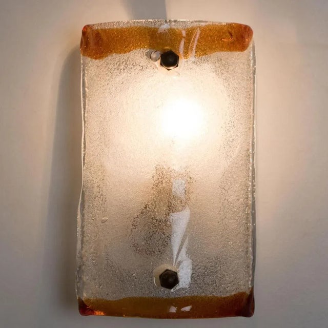 Beautiful rectangle wall light made by carlo nason. With a crystal clear glass plate, and brown edges, this beautiful...