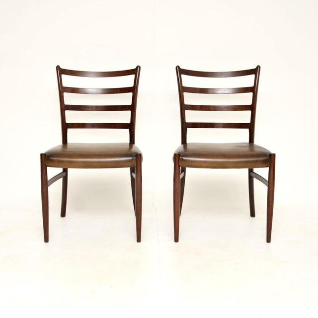 A rare and extremely stylish pair of Danish chairs by Johannes Andersen. They were made in Denmark, they date from the...