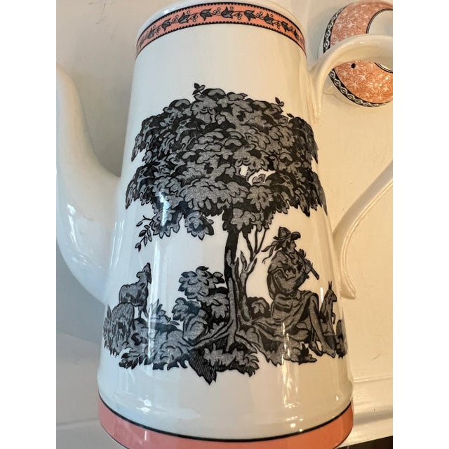 Beautiful art work in black with orange accents on this wonderful ceramic tea pot. Measuring 10” tall . The rim measures 3...