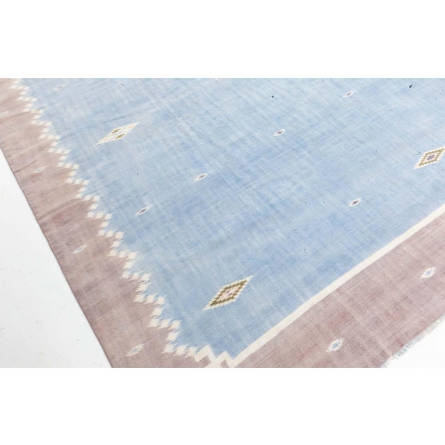 Vintage Indian Dhurrie rug Size: 10'9" × 14'2" (327 × 431 cm) Crafted in mid-20th century India, this vintage Dhurrie rug...
