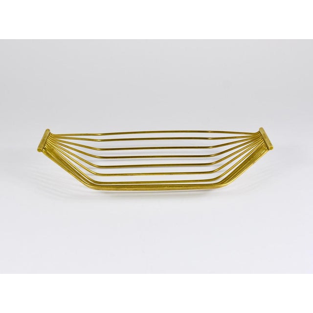 A sleek and minimalistic yet sculptural modernist fruit basket, handcrafted in Austria during the 1950s. Made from brass,...