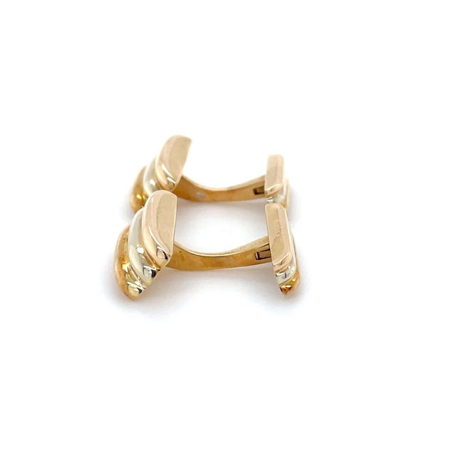 A pair of classic Cartier cufflinks from their Trinity Collection. Designed with yellow gold, white gold and rose gold...