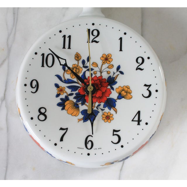 Vintage porcelain wall clock with floral motif by Limoges. Made in France. Uses standard C Battery. Works as should. There...