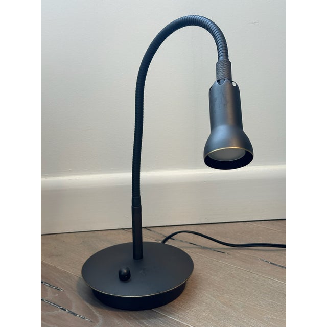 Used vintage lamp in good condition (used bulb included). Holtkotter reading lamp has an adjustable lens that focuses the...