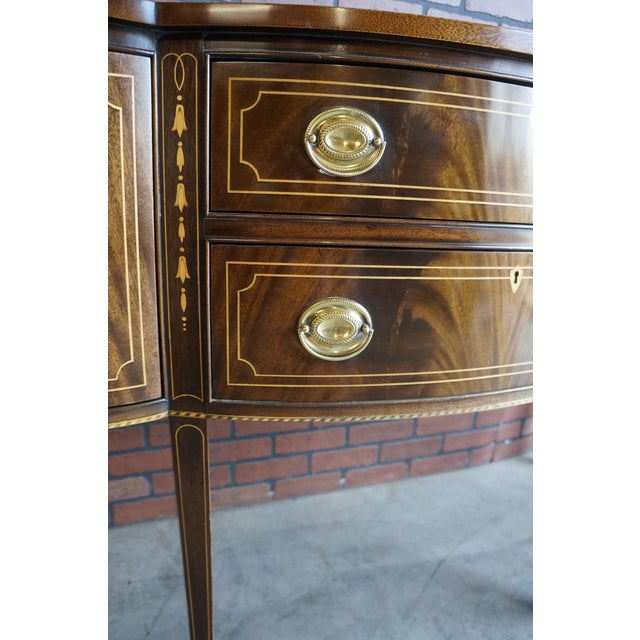Exceptional Federal style sideboard by Stickley. Featuring lovely veneer work and intricate inlays with a multi tone...