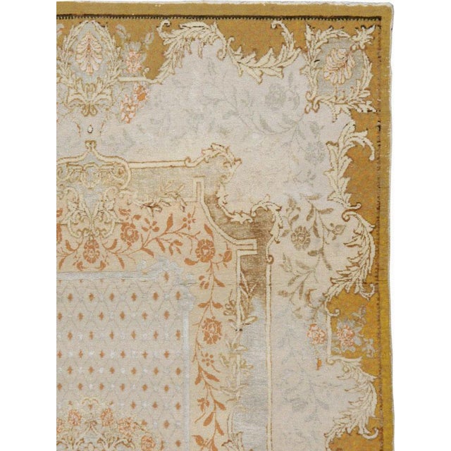 An antique Turkish Souf Hereke carpet from the first quarter of the 20th century. The medallion and guard-border offer an...
