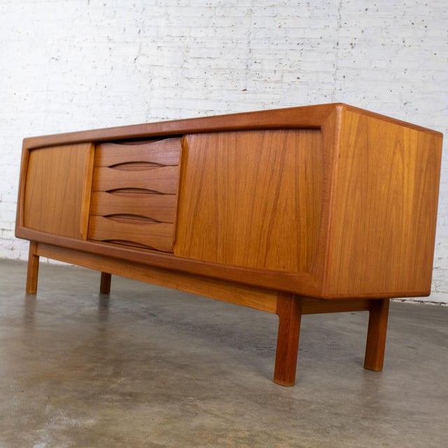Handsome vintage Scandinavian Modern credenza, buffet, or sideboard by Skovby Furniture and made in Denmark composed of a...