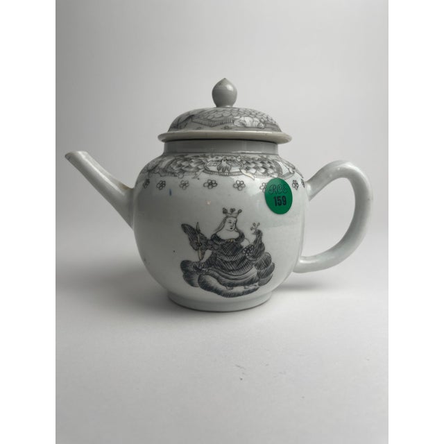 This Chinese export porcelain teapot, decorated in grisaille with a Juno and peacock motif, is a refined example of 18th-...