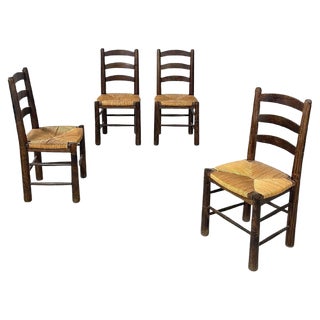 Mid-Century Modern French Dark Wood and Straw Chairs by Georges Robert, 1950s, Set of 4 For Sale