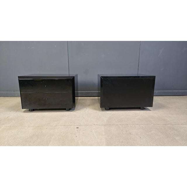 Pair of vintage black lacquered bedside cabinets by Interlubke. Each cabinet has 2 drawers. Timeless design 1970s -...
