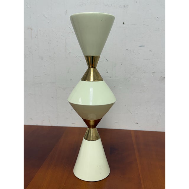 Design Plus Gallery presents the Hourglass Pillar Candle Holder by Hamilton Park Interiors. This sculptural candle holder...