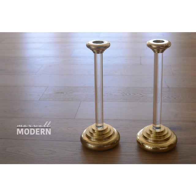 Vintage pair of large lucite and brass candlesticks attributed to Charles Hollis Jones. Designed in the Art Deco style and...