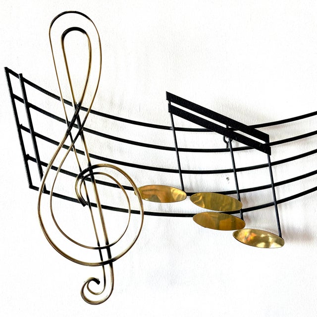 This Curtis Jere design is signed and dated with black metal and polished brass accents.