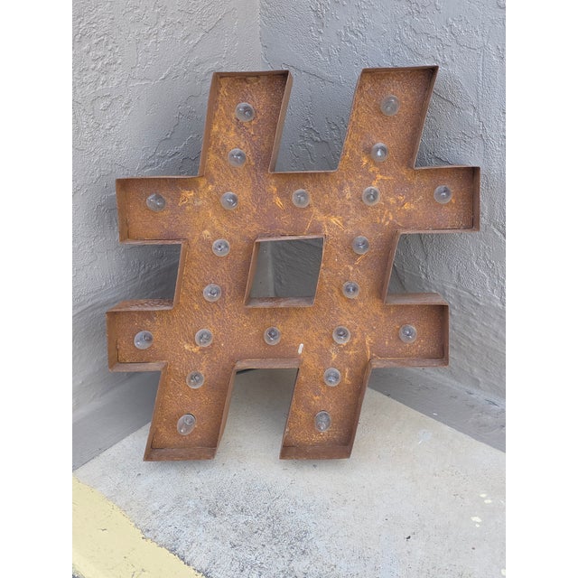 Great looking rustic metal light up symbol..(pound, number,or hash tag) The lights were added and are just holiday lights...