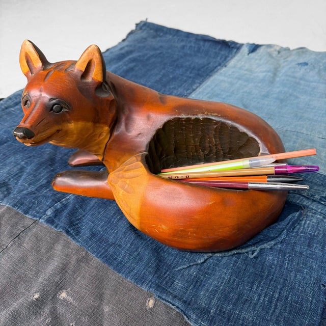 Charming hand-carved fox from Hokkaidō with a hollowed, bowl-shaped recess in the back. This makes the piece not only...