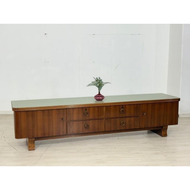 Stylish vintage lowboard in very good condition. The top has been professionally sanded and stained in a soft vintage...