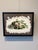 This oil on panel painting features a detailed animal skull entwined with vibrant green ivy, creating a striking contrast...