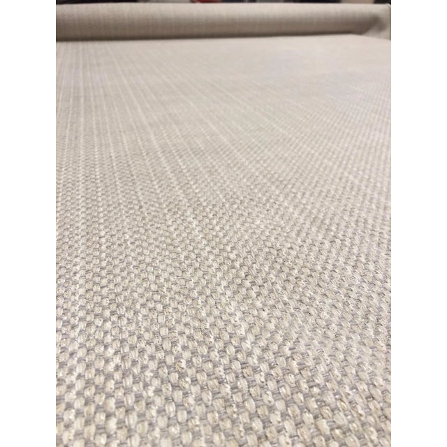 This tweed fabric from Kravet has a coarse hand and rigid drape. The color scheme is a blend of warm neutral beiges in the...