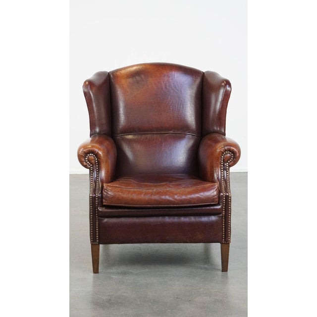 This vintage sheep leather wing chair with wonderful seating comfort and a beautiful patina. Are you looking for a...