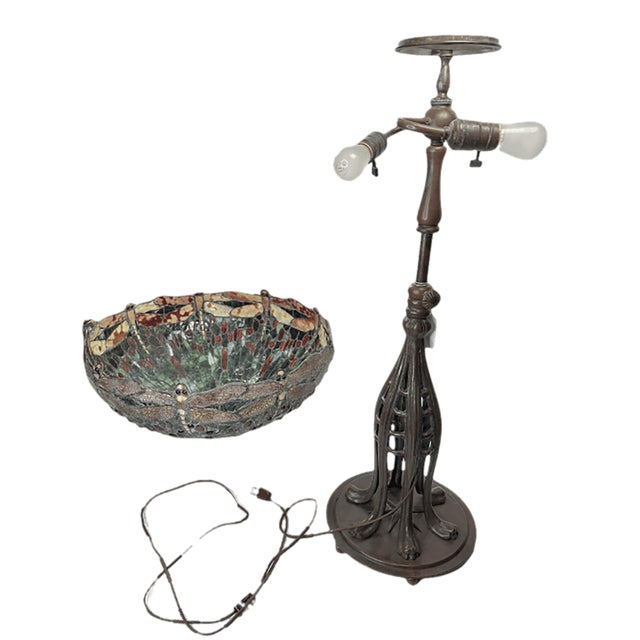 A pair of extraordinary art nouveau Tiffany style lamps with hand-made leaded glass shades. Each lamp shade has a unique...