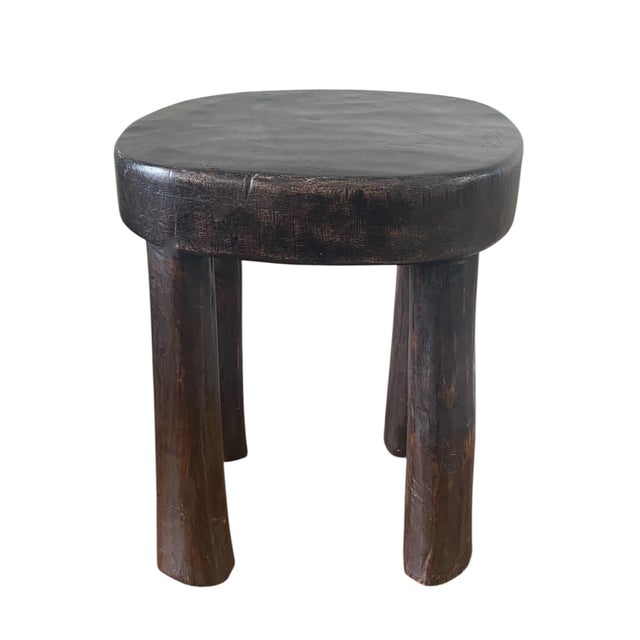 This stunning vintage African wooden milk stool, skillfully crafted by the Hehe Gogo people in Tanzania from one piece of...