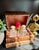 Beautiful, French gilt leather faux book liquor tantalus set with interior brass fittings. The set includes, 2 decanters...