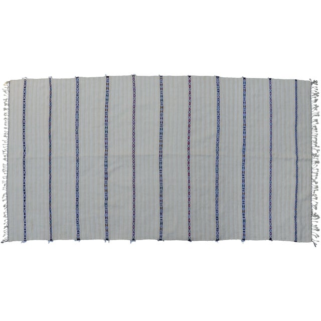 Vintage wedding blanket handmade in the High Atlas Mountains of Morocco. Featuring stripes of wool fringe with sequined...