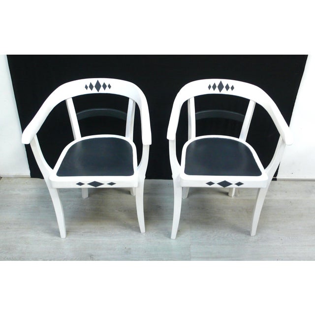 Two chairs from the bauhaus era in the gropius style, armchairs made of solid wood, circa 1920s. the chairs were once...